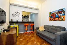 Living room with TV and sofa.
