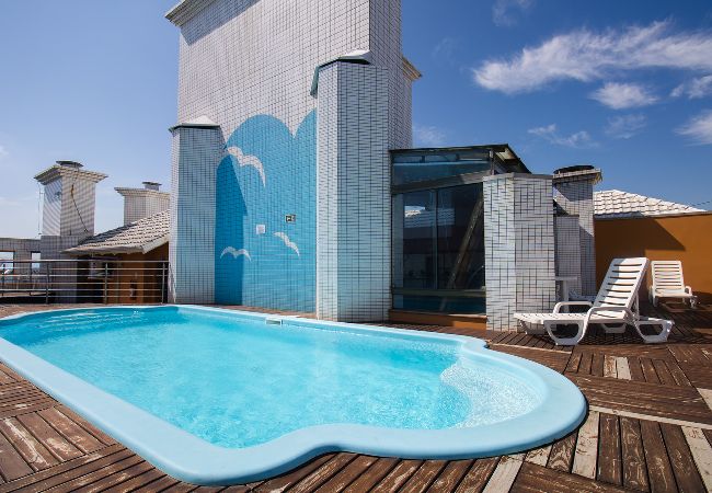  in Capão da Canoa - Apto c churrasq, piscina e wi-fi a 200m da praia